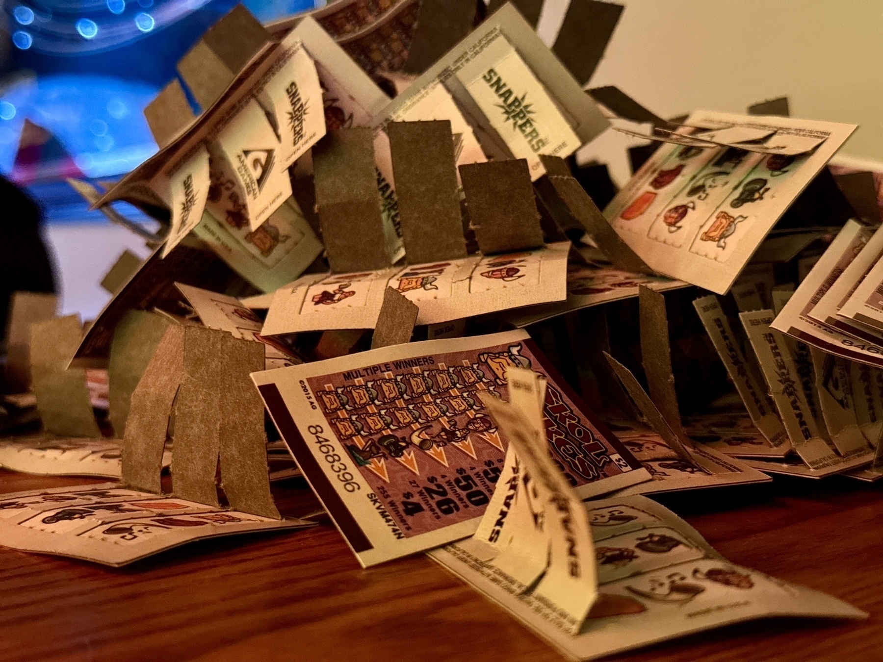 pile of a pull-tabs with Viking imagery on a wood tabletop