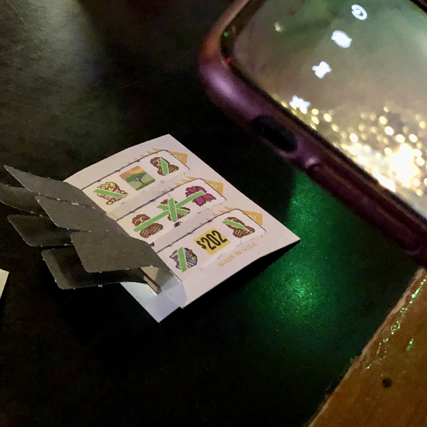 opened pull-tab win in dimly lit bar